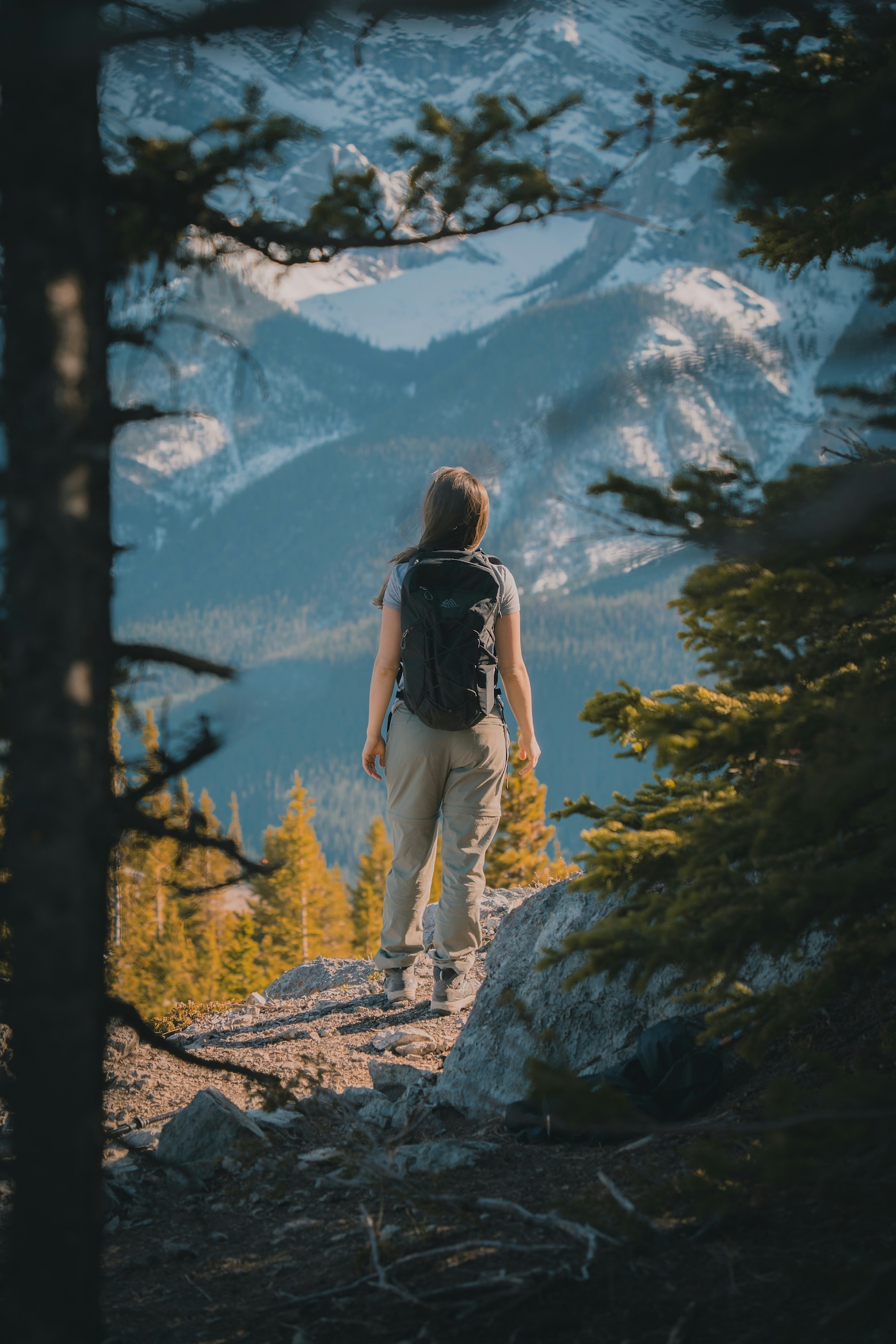 Hiker walking a mountain trail with a backpack